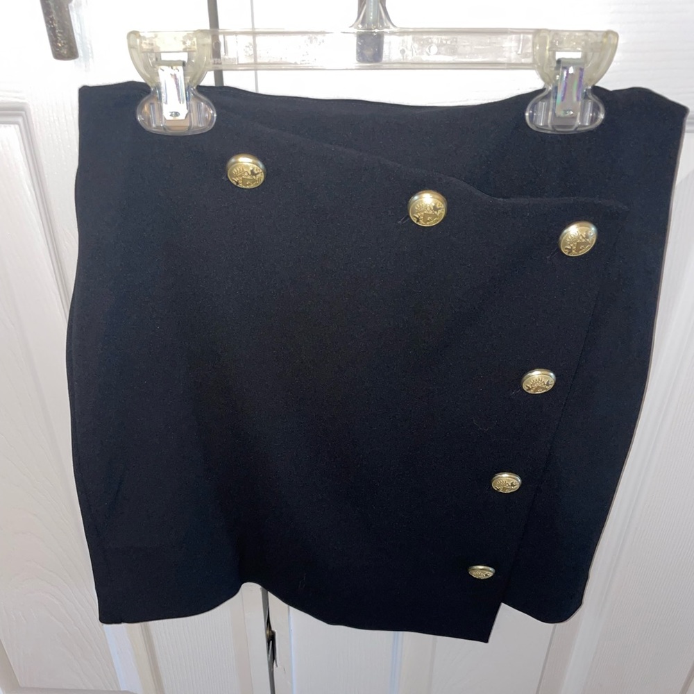 Black mini skirt with gold buttons